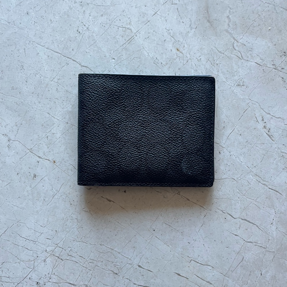 COACH Signature canvas charcoal foldable wallet in pristine condition.